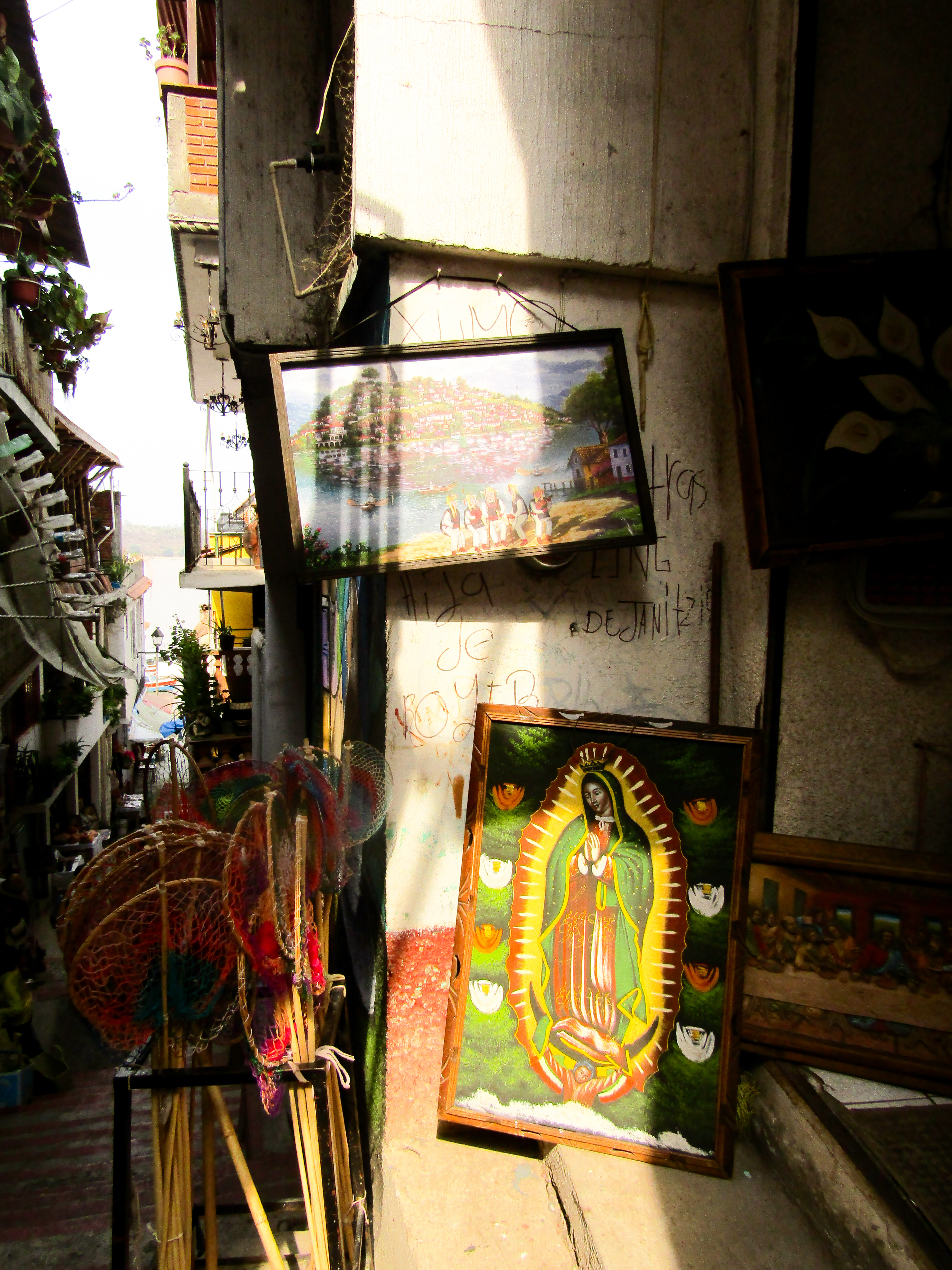 Alleyway with Guadalupe painting